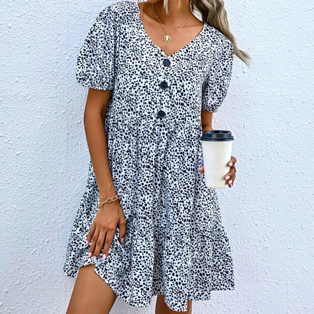 Dress, almost cow print, mid thigh length with buttons short sleeves and ruffles